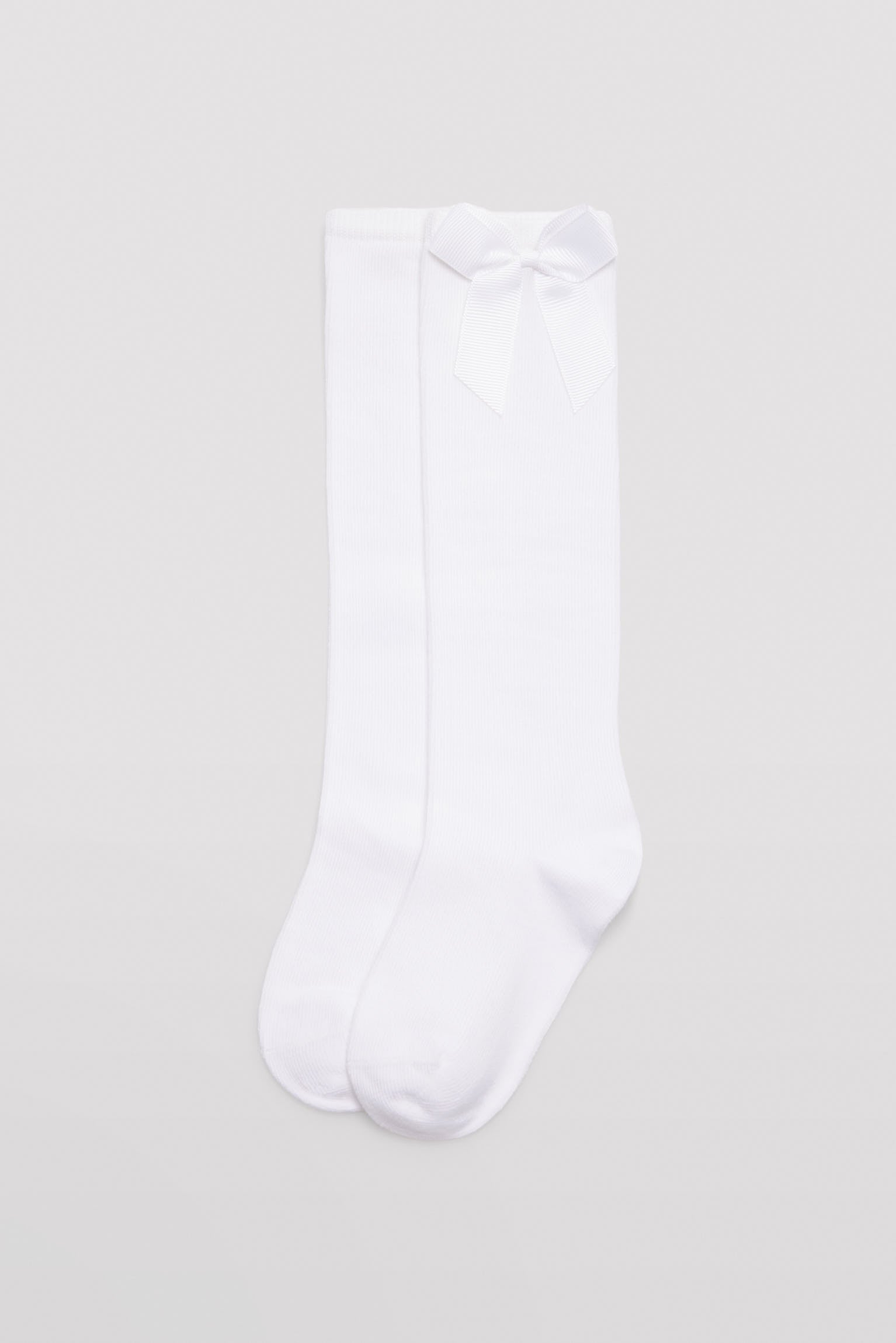 Calcetín infantil largo detalle lazo blanco