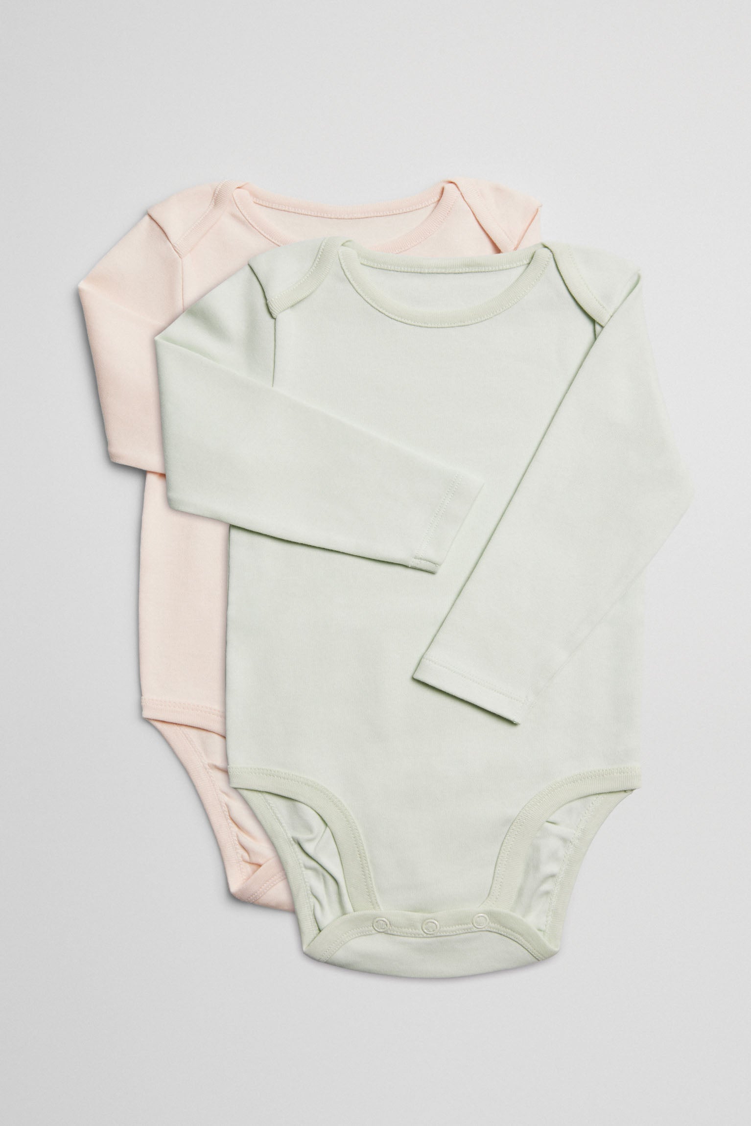 Pack 2 bodies bebé básicos manga larga solapas verde y rosa