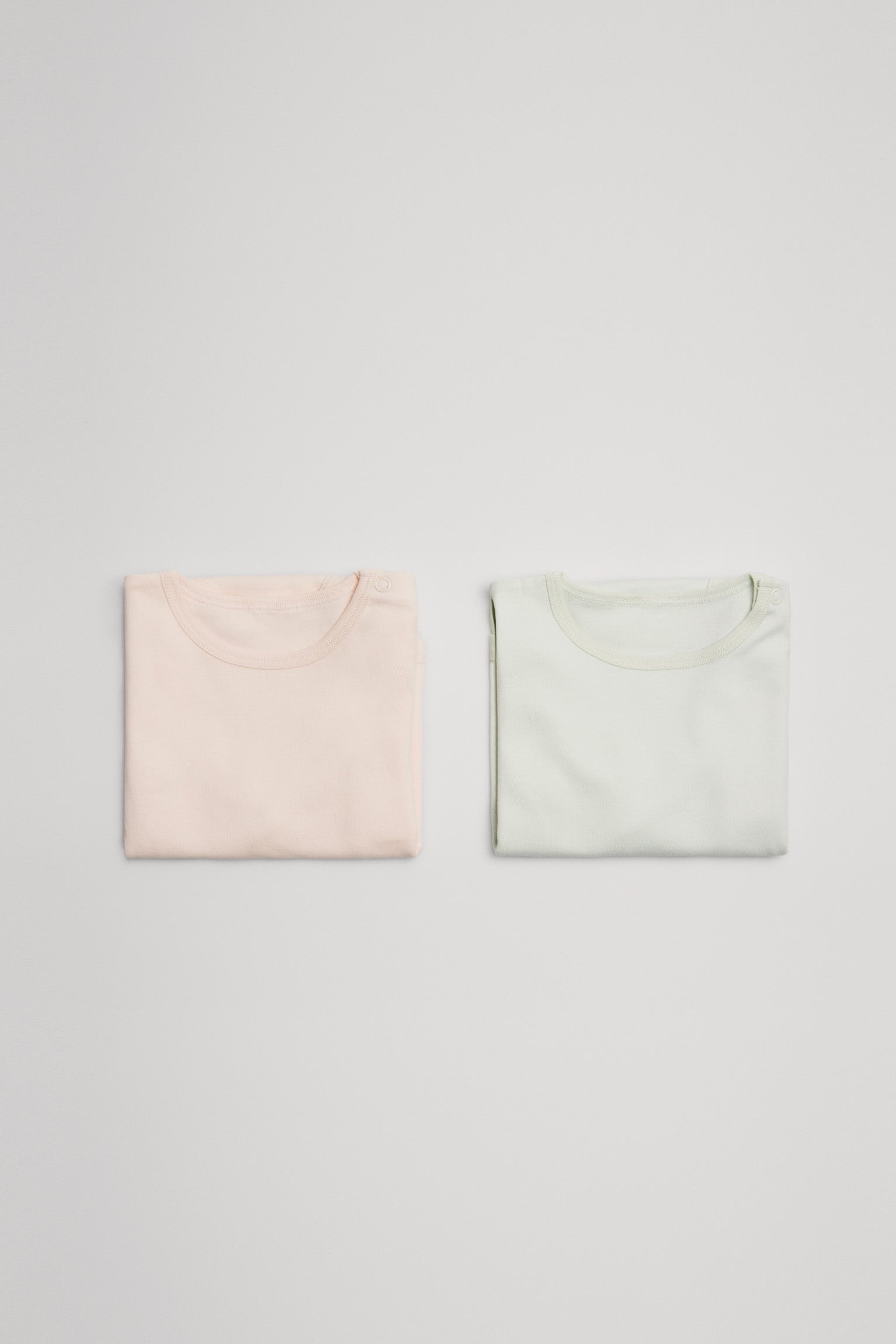 Pack 2 bodies bebé básicos manga larga pastel