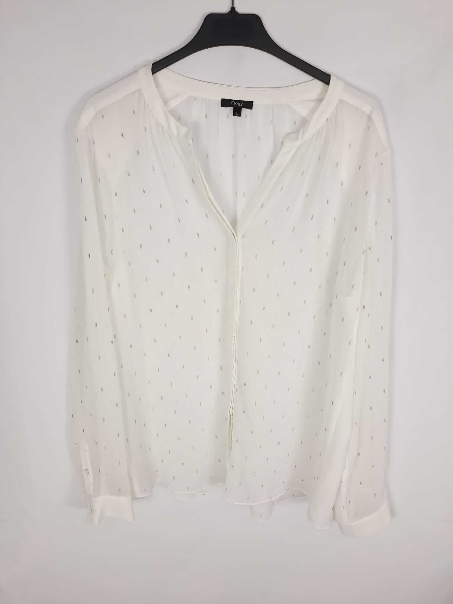 ELOGY.Blusa plumeti plateado T.L