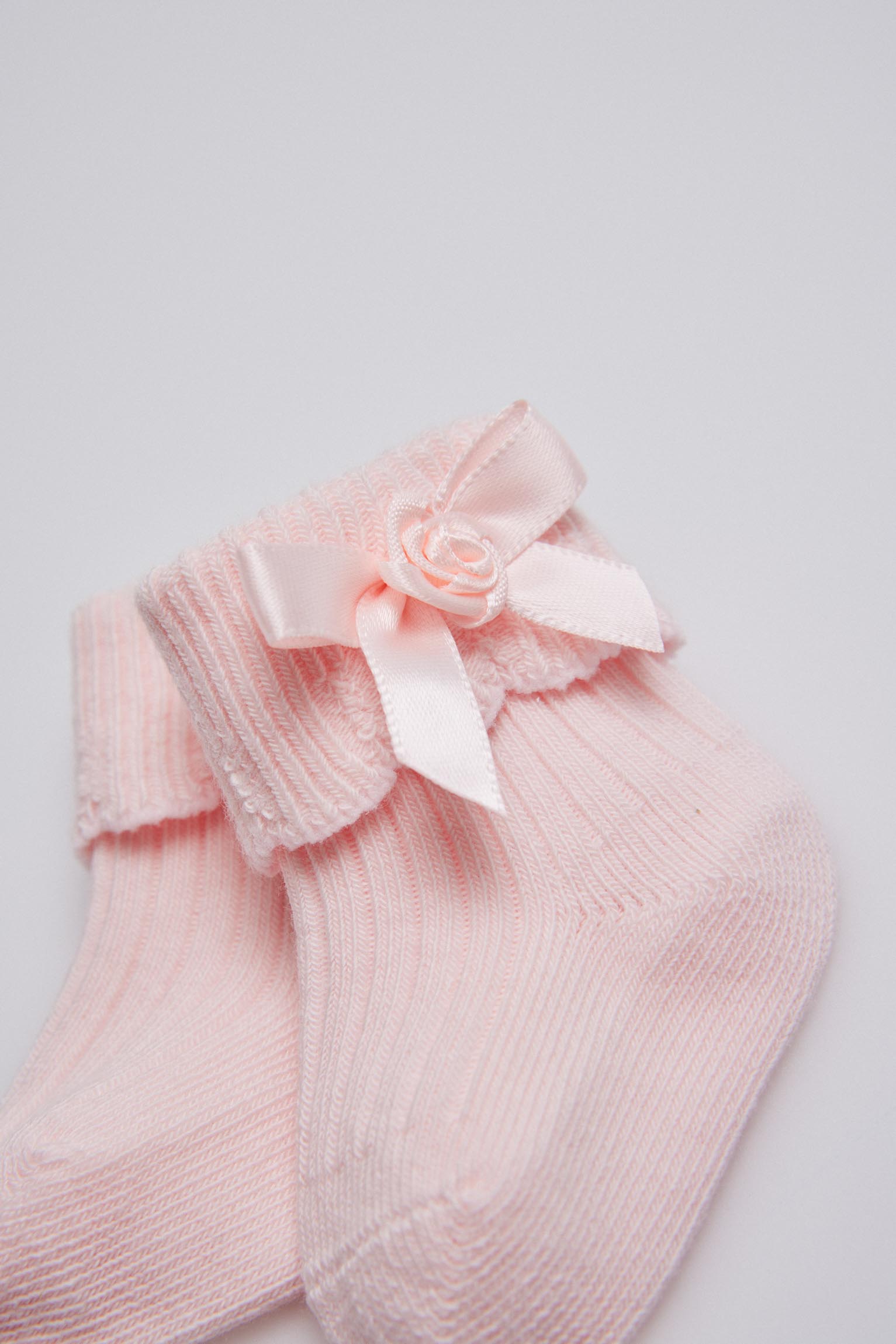 Calcetines canalé con lazo recién nacido rosa