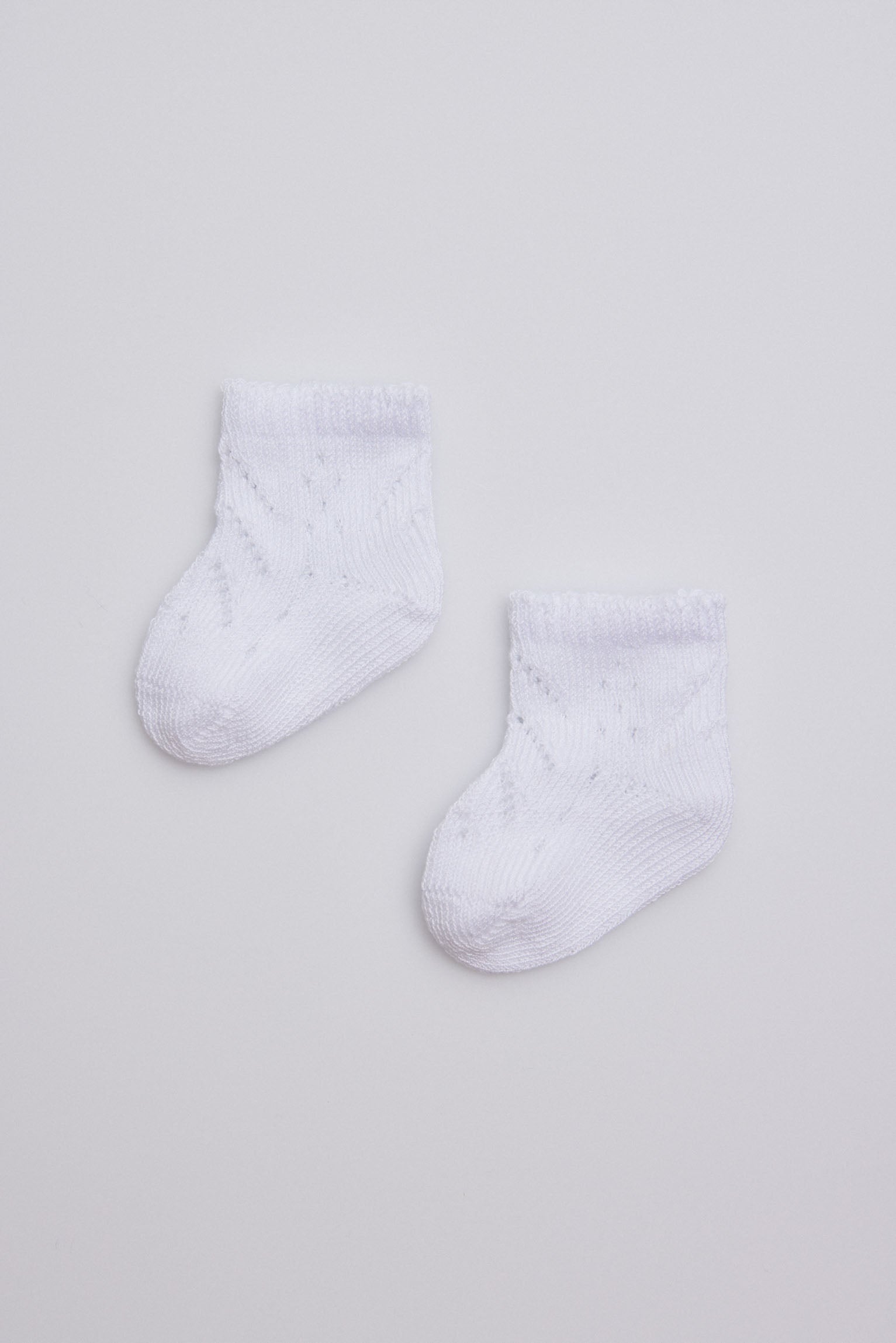 Calcetines perlé recién nacido blanco