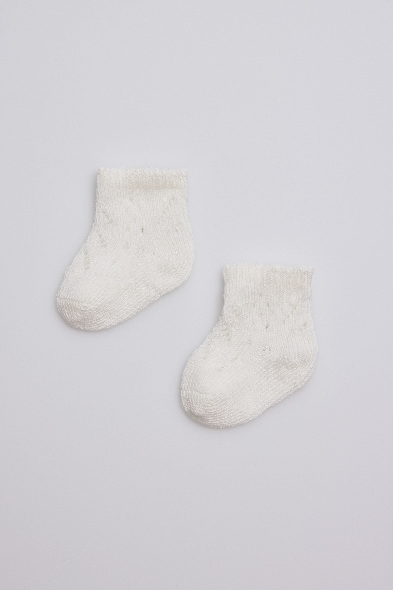 Calcetines perlé recién nacido marfil