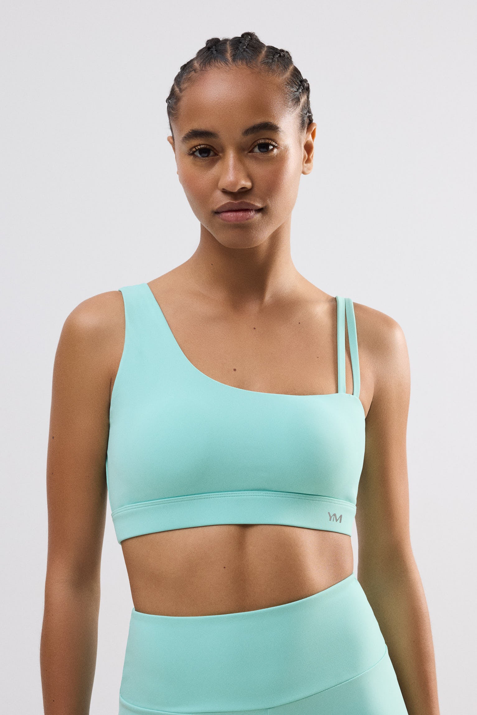 Sujetador deportivo asimétrico sujeción ligera celeste