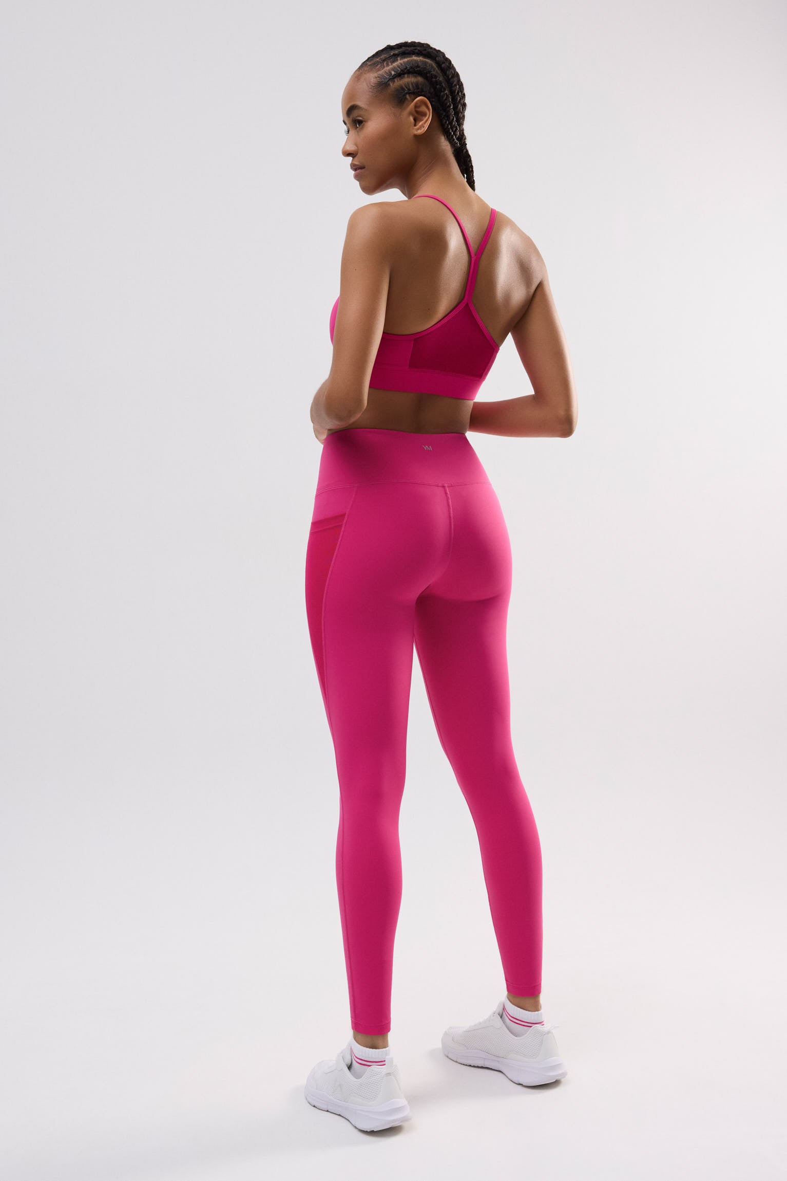 Leggings deportivos largos bolsillo lateral fucsia