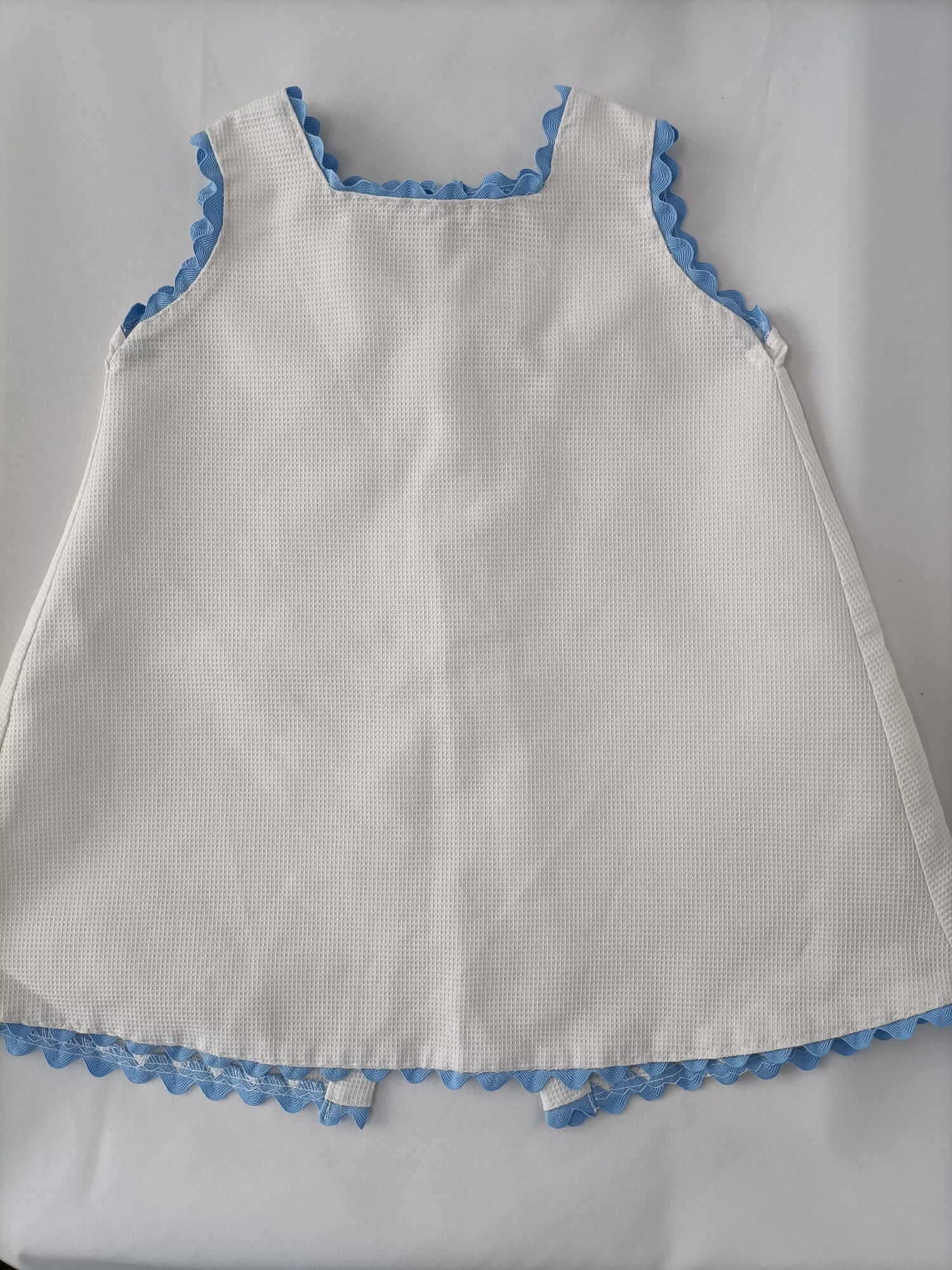 OTRAS.Faldón blanco piqué T.9-12 meses