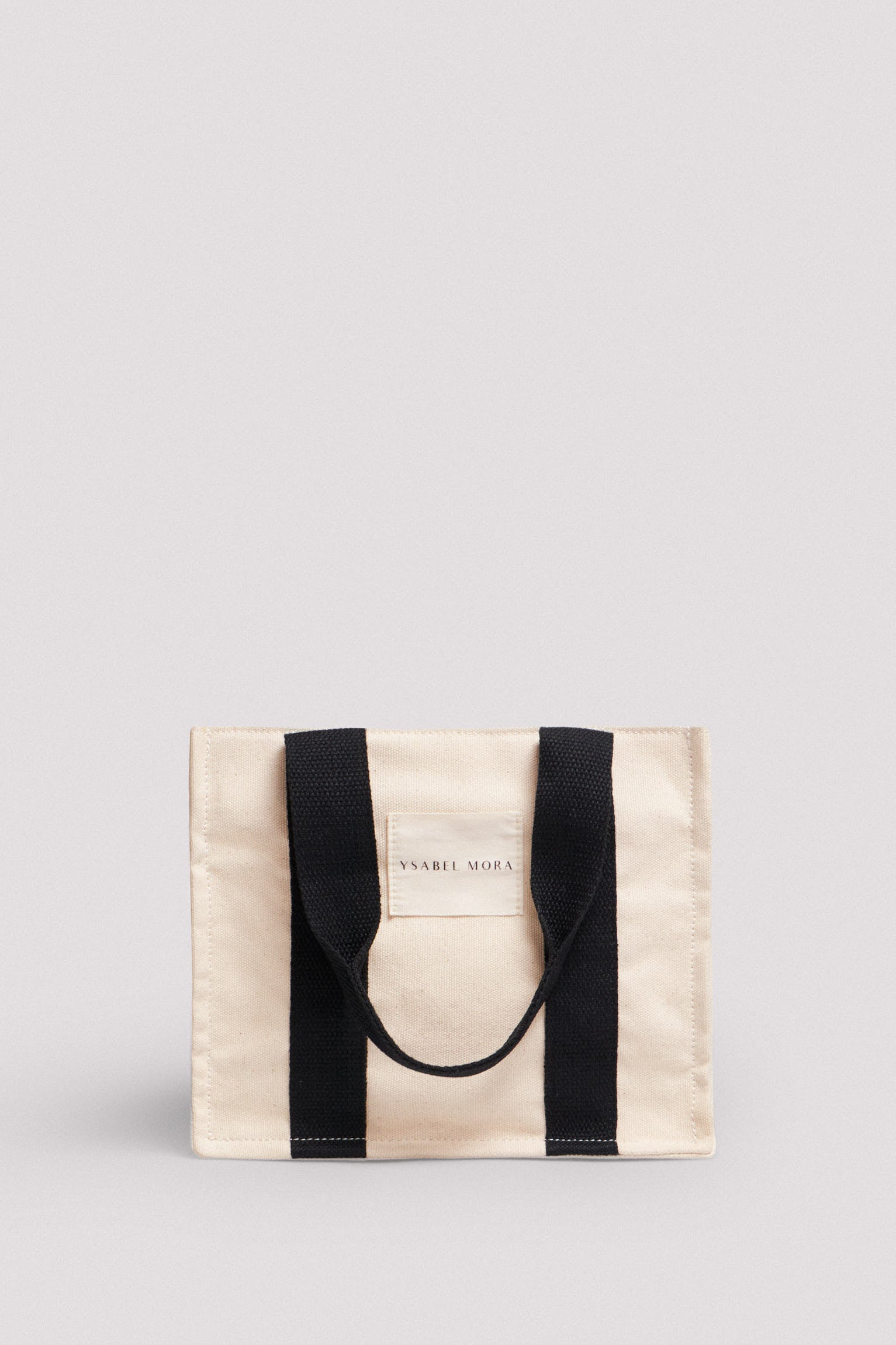 Bolso mini marfil con asas en negro