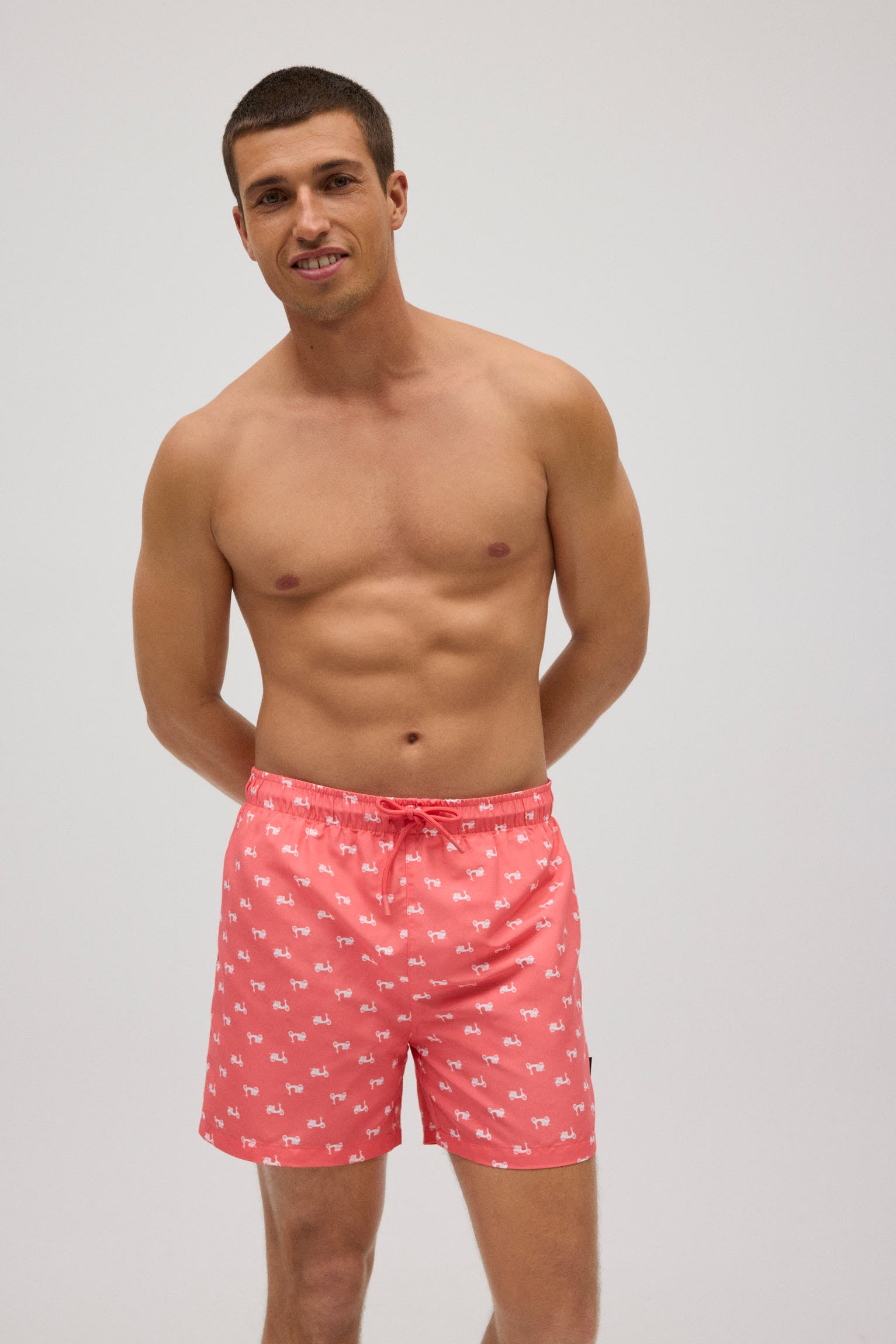 Bañador medio estampado vespas coral