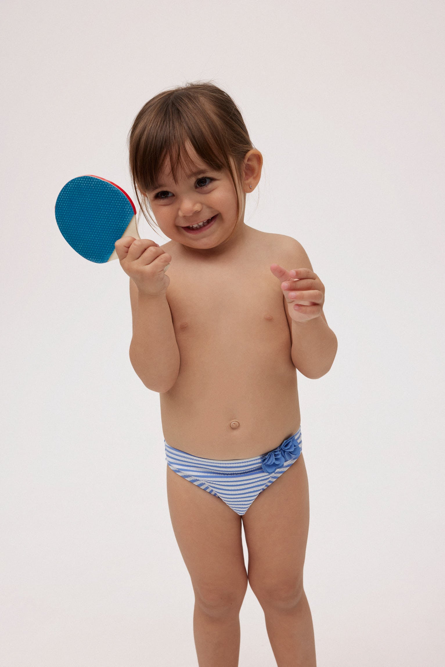 Bañador culetín bebé rayas azules con textura detalle flores