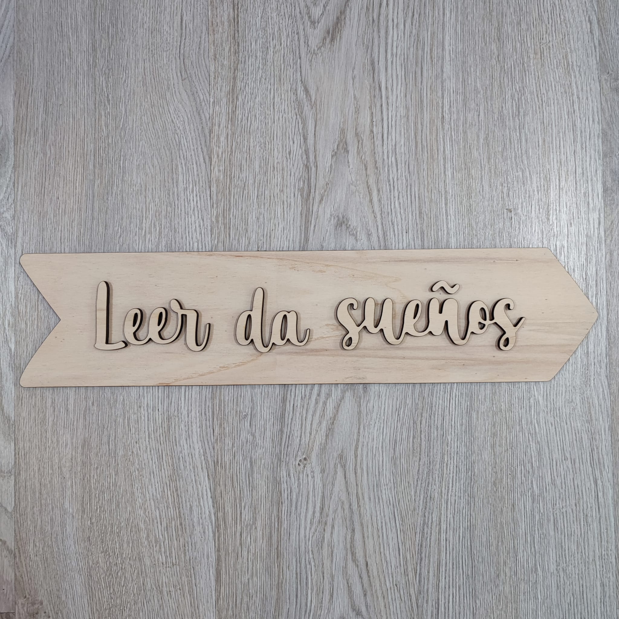 Flecha «Leer da sueños»