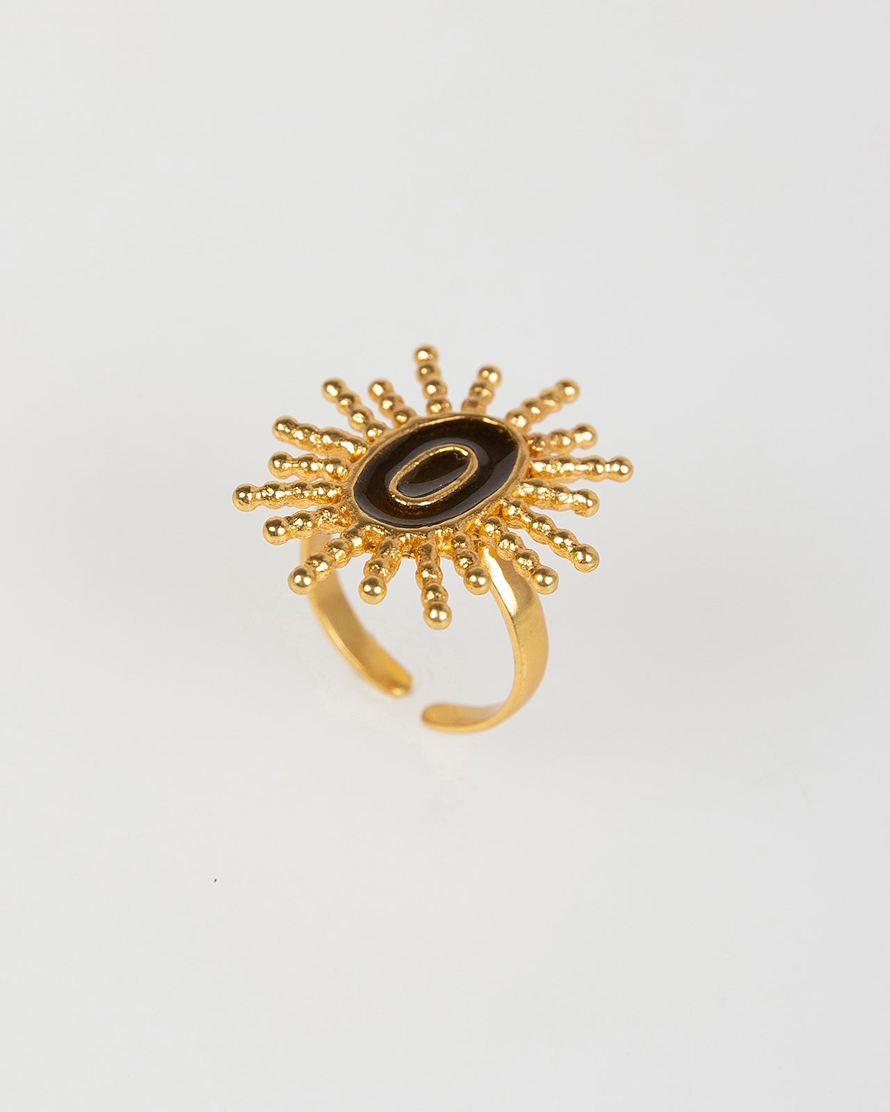 Anillo abierto dorado con sol negro