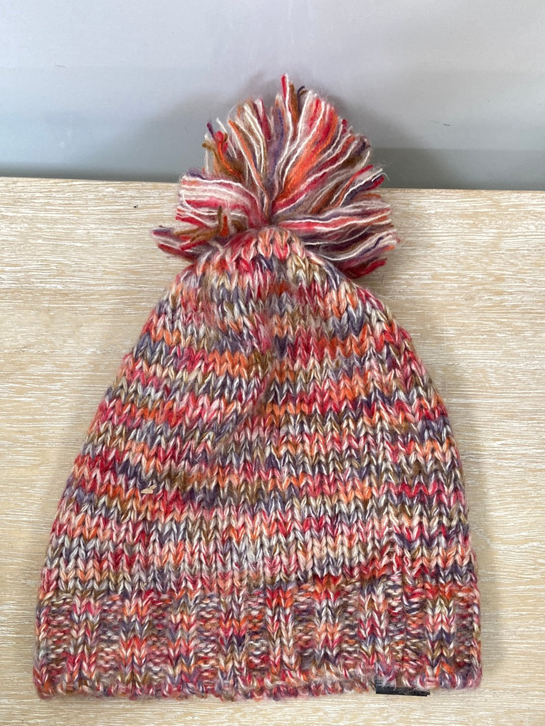 PARFOIS.Mono pompón multicolor